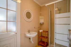 a bathroom with a sink and a shower at Villa Alegra Paul do Mar in Paul do Mar +20 photos