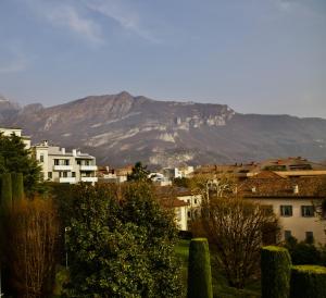a view of a city with a mountain in the background at "Felicita" San Francesco lake view Relax Apartment in Lecco