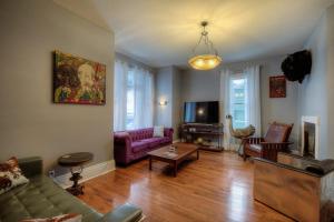 a living room with a couch and a table at Addie House in Lead