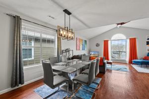a dining room and living room with a table and chairs at Spacious Corporate Condo - 2bd/2ba in Madison