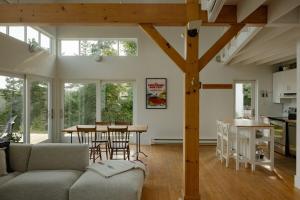 a living room with a couch and a table at The Beach Barn & Cedar Sauna in Kingsburg