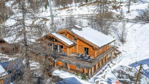 an overhead view of a log cabin in the snow at Chalet K2 in Isola