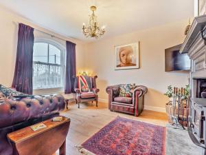 a living room with a couch and two chairs at 3 Bed in Freshwater oc-92961 in Freshwater