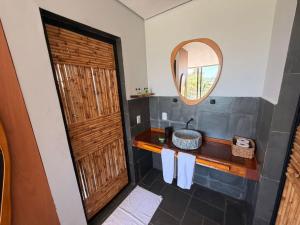 a bathroom with a sink and a mirror at Hotel Boutique Vila don Patto in São Roque +21 photos