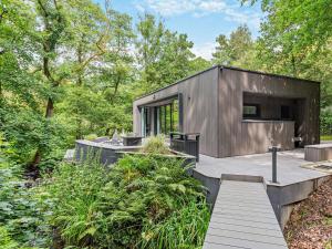 a small house in the woods with a wooden deck at 2 Bed in Skipton oc-86230 in Elslack