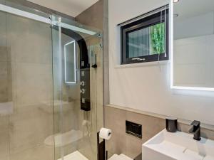 a bathroom with a glass shower and a sink at 2 Bed in Skipton oc-86230 in Elslack