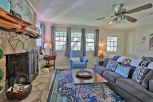 a living room with a couch and a fireplace at Arbor Creek in Wimberley