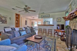 a living room with a couch and a table at Arbor Creek in Wimberley