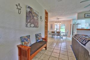 a living room with a couch and a dining room at Arbor Creek in Wimberley +21 photos