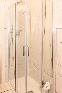 a shower with a glass door in a bathroom at Suite900 - Apartment Premium Suite in Arezzo +30 photos