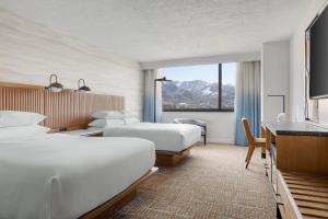 a hotel room with two beds and a desk at Salt Lake City Marriott University Park in Salt Lake City +54 photos