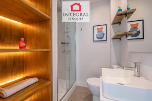 a bathroom with a toilet and a sink and a shower at Les Voltes in Palamós +70 photos