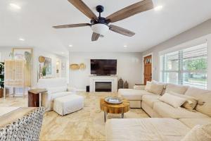 a living room with a couch and a ceiling fan at R&R Acres in Aransas Pass