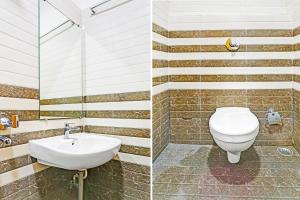 a bathroom with a toilet and a sink at Super Hotel O Raipur in Raipur