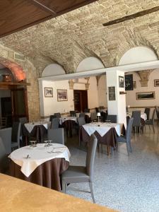 a restaurant with tables and chairs in a room at Albergo Ristorante Terme in Acquasanta Terme +55 photos