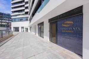 a building with a sign on the side of it at CP Apartments San Mamés in Bilbao