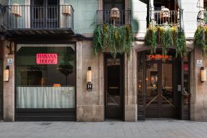a store with doors and windows with a sign on it at chic&basic Habana Hoose in Barcelona