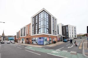 a building on the corner of a city street at Single Ensuite Rooms In Central Preston in Preston
