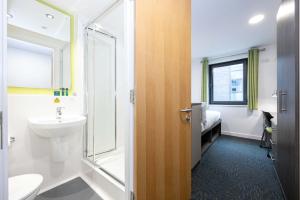 a bathroom with a toilet sink and a shower at Single Ensuite Rooms In Central Preston in Preston