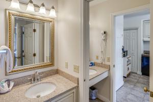 a bathroom with two sinks and a mirror at Ski in-out, Slope and Pool Views 1BR at Country Inn in Hancock