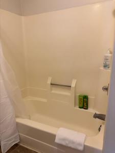a bathroom with a white tub and a white towel at Ski in-out, Slope and Pool Views 1BR at Country Inn in Hancock +20 photos