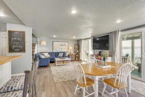 a dining room and living room with a table and chairs at ‘Cliff View Haven’ | Million-Dollar Views at 6MM in Rocky Mount