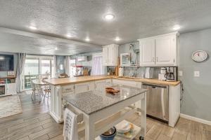 a kitchen with white cabinets and a counter top at ‘Cliff View Haven’ | Million-Dollar Views at 6MM in Rocky Mount