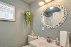 a bathroom with a sink and a mirror at ‘Cliff View Haven’ | Million-Dollar Views at 6MM in Rocky Mount +33 photos