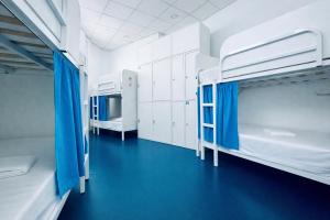 a room with two bunk beds in a hospital at Hostel Albergue Baionamar in Baiona