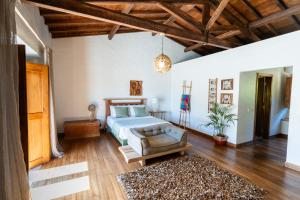 a bedroom with a bed and a wooden ceiling at Casa do Cabeço in Maiorga +43 photos