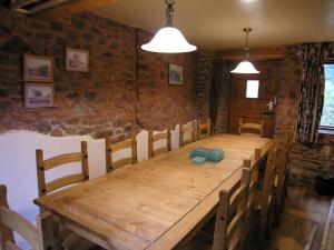 a dining room with a wooden table and chairs at Selworthy- Ukc4915 in Timberscombe