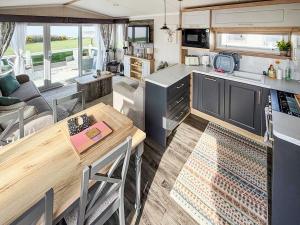an open kitchen and living room in a caravan at Bordeaux in Heysham