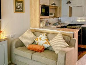 a couch with pillows on it in a kitchen at Bordeaux in Heysham