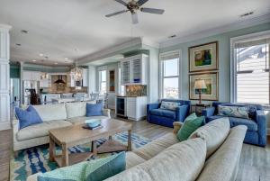 a living room with a couch and a table at Tipsy Turtle North- Oceanfront Oasis - Pool - Dog Friendly in Surf City