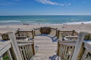 a wooden stairway to the beach with a view at Tipsy Turtle South-bOceanfront Oasis - Dog Friendly - Pool in Surf City +53 photos