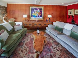 a living room with two couches and a coffee table at Coelard The Barn - Uk50538 in Appin +26 photos