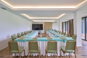 a conference room with a long table and chairs at Caloura Hotel Resort in Caloura
