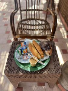a plate of food on a wicker table at Keylany Hotel Aswan in Aswan