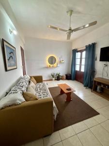 a living room with a couch and a table at Confort total, cerca de todo in Asunción