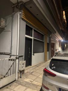 a car parked in front of a building at CITY Loft Lux in Thessaloniki