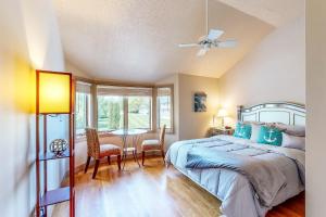 a bedroom with a bed and a table and chairs at The Boat House w/ Dock: Enjoy Lake Life! in North Webster