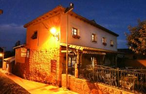 a building with a street light in front of it at El manzano in Castrojeriz