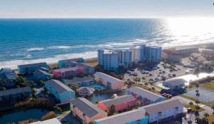 an aerial view of a resort next to the ocean at Vibrant gulf condo with pool and beach access in Pensacola Beach