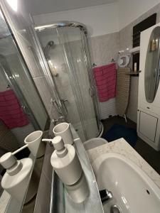 a bathroom with a tub and a sink and a shower at Casa LynaeL Saint Roch in Nice