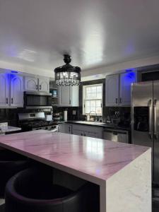 a large kitchen with a large island in the middle at The Slate and Stone House in Buffalo