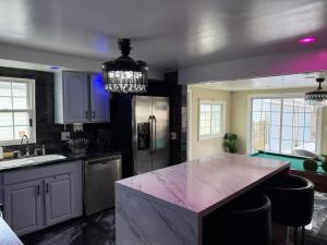 a kitchen with a marble counter top in a room at The Slate and Stone House in Buffalo