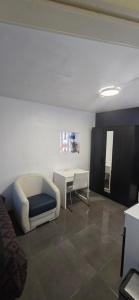 a living room with a couch and a table at Room dream in Wiltz +1 photo