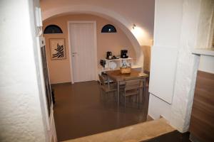 a kitchen and dining room with a table and chairs at Tracce nel Borgo in Putignano +34 photos