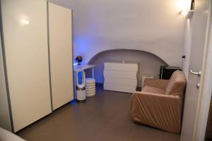 a living room with a couch and a chair at Tracce nel Borgo in Putignano