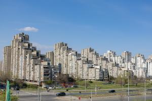 a large city with tall buildings in the background at Don Vito in Belgrade